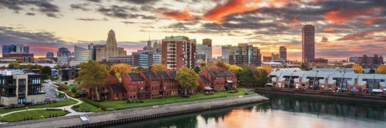 The Buffalo skyline at sunset seen across the water