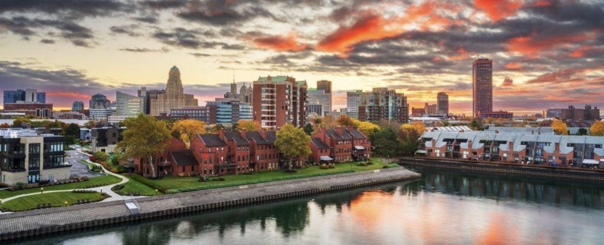The Buffalo skyline at sunset above the waterfront
